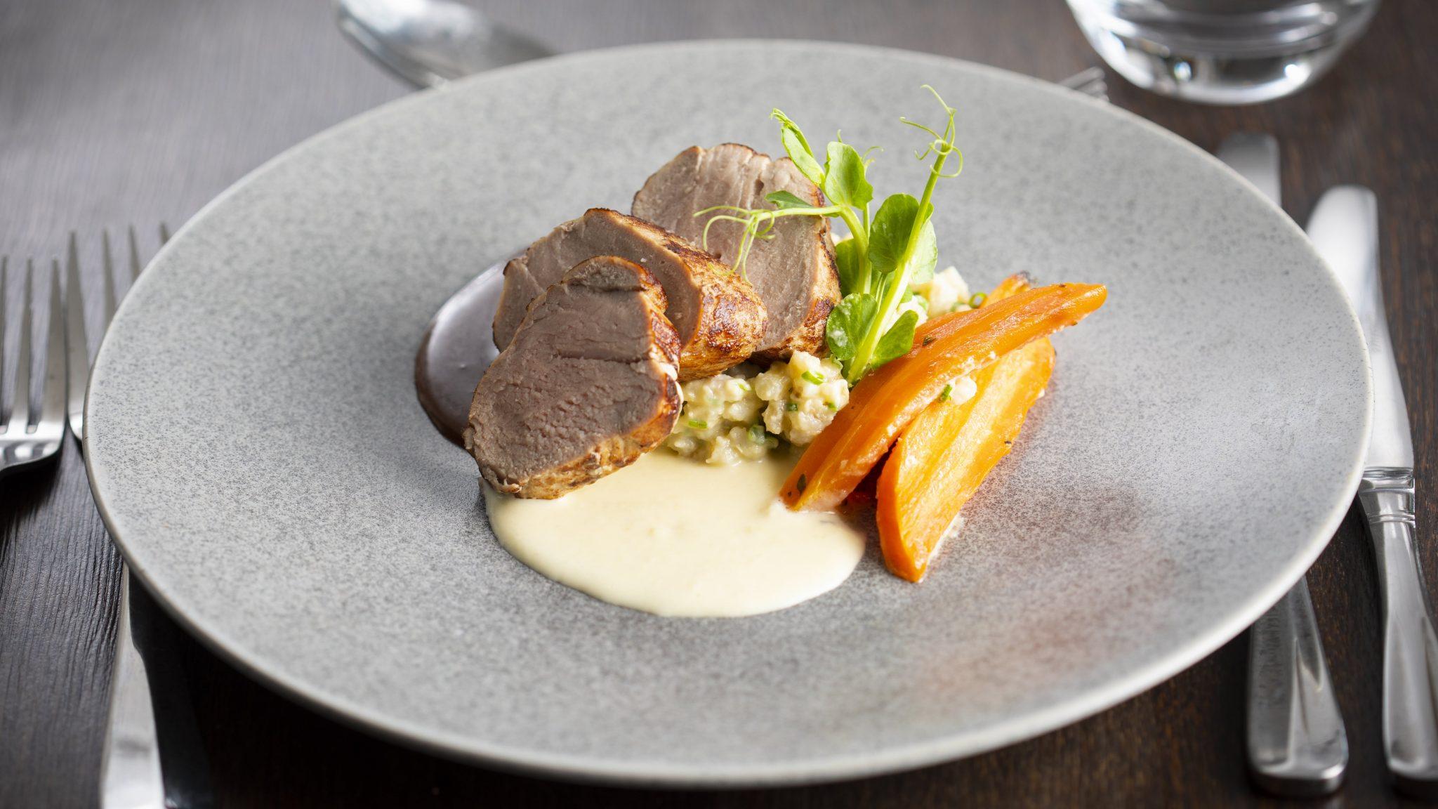 A plate with an appetising meal, beautifully presented and ready to enjoy.